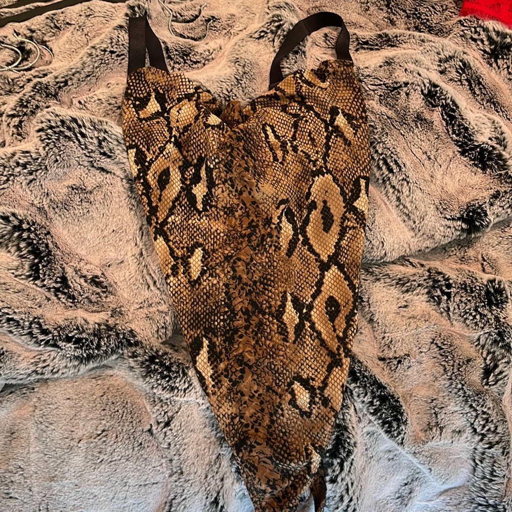 Snake skin body suit.